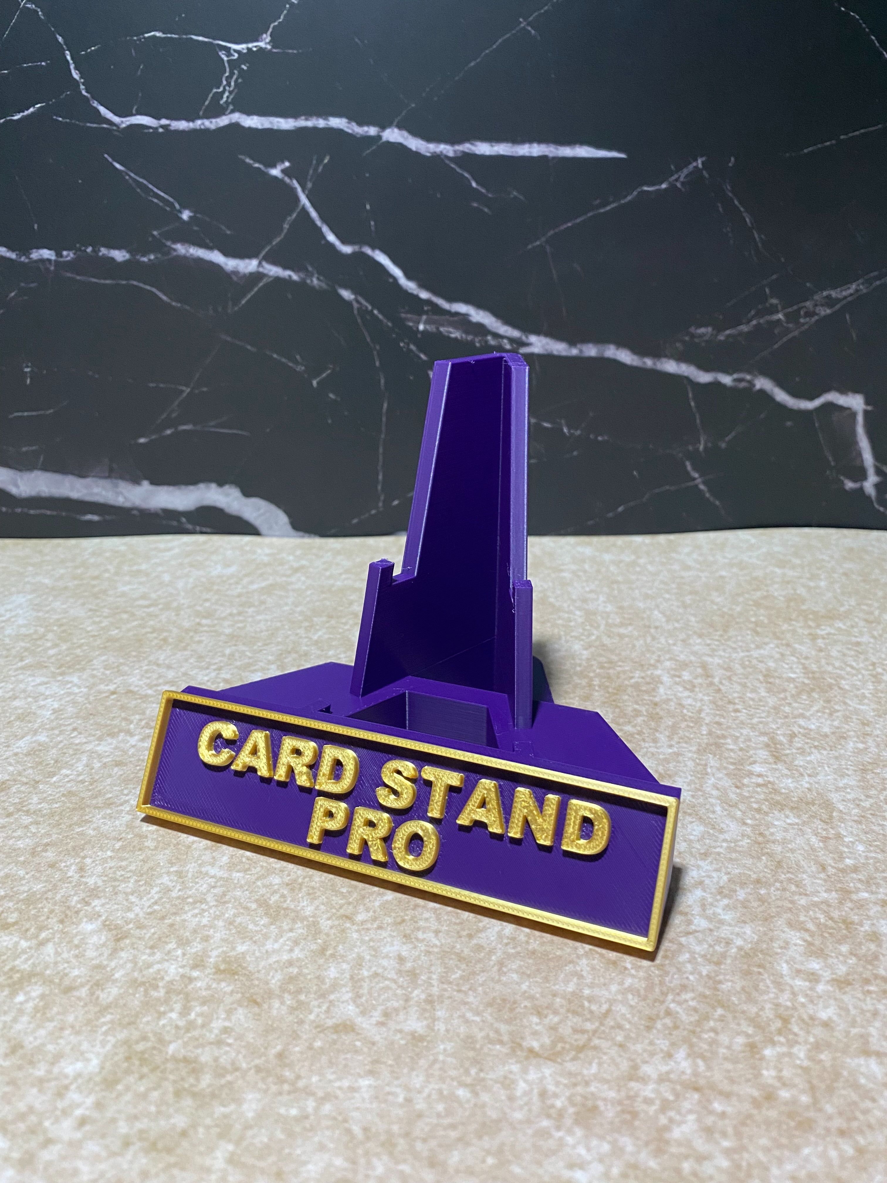 Actual purple Card Stand Pro with gold lettering and border